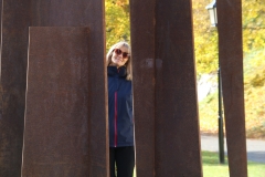 Sharon behind rusty sculpture